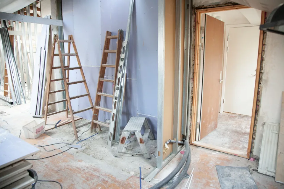 Room under repair with ladders and tools in Brushy Creek, TX